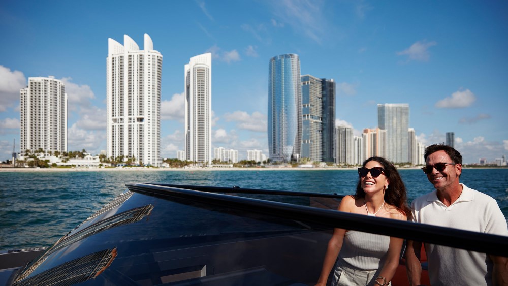 A husband and wife on a boat in the ocean along the Florida coast