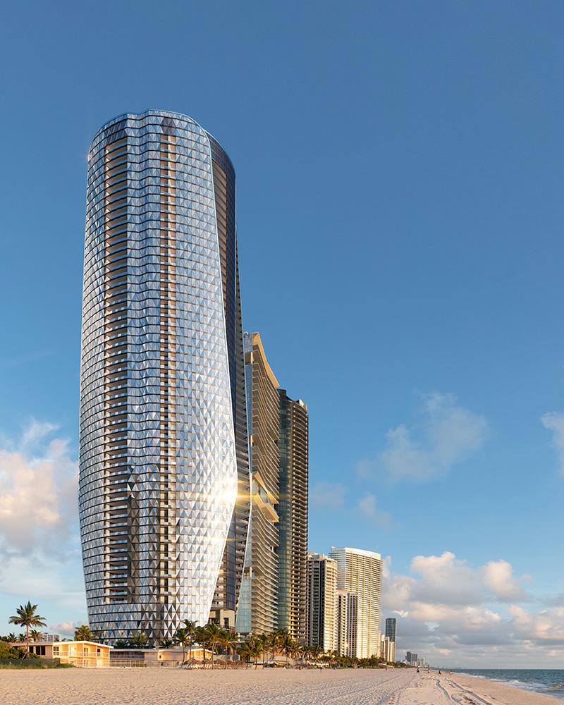 A beautiful oceanside tower with a reflective glass facade